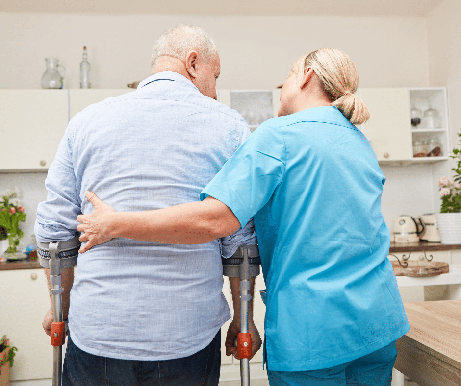 nurse helping old man to walk